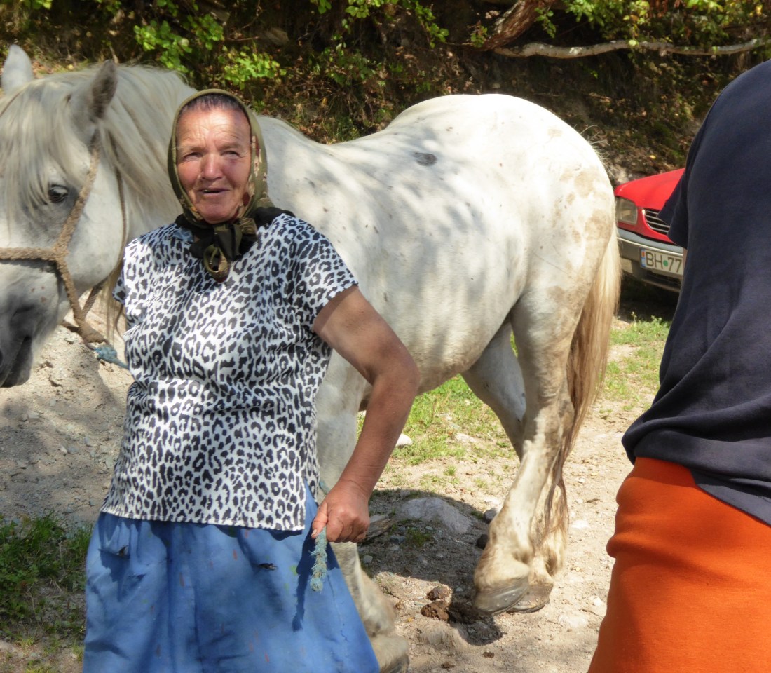 Village woman taking her horse to the local well for a drink